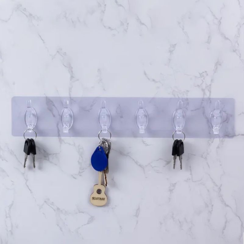 PORTE MANTEAU ADHESIF 6 POSITIONS COULEUR TRANSPARENT / OR